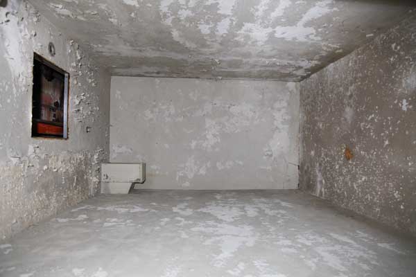 Here is an isolation cell.  It's just an empty room.  Patients were left there for hours, days and even weeks, to languish while being restrained in a straight jacket.