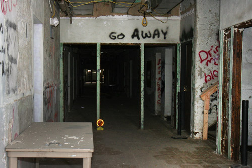 &quot;Go Away&quot; warns the grafiti.  Is it just a Halloween prank spray painted by a vandal, or is there a real message there?  In old haunted places like the Bartonville Insane Asylum, one could never be sure.